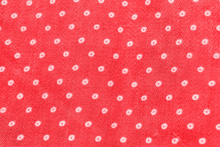 Texture of red cloth with white dots
