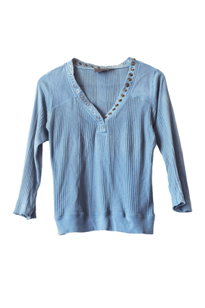 Blue knitwear pullover with metal rivets isolated over white の写真素材