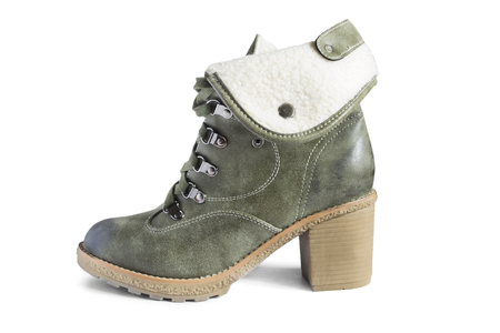 Khaki heeled high boot with fur lapel isolated over whiteの写真素材