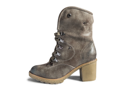 Brown leather heeled high boot on white の写真素材