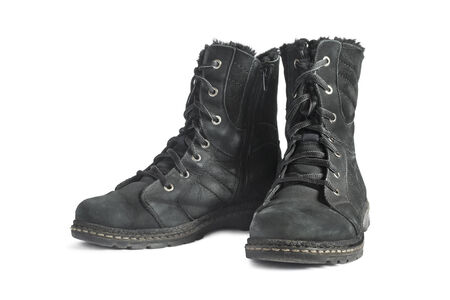 Pair of black nu buck leather hiking boots on white の写真素材