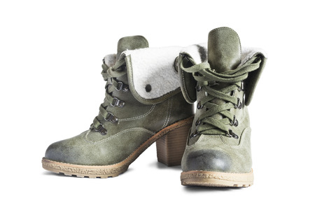Pair of khaki leather heeled boots isolated over whiteの写真素材