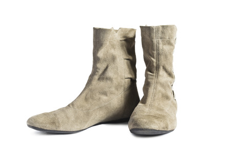 Pair of suede soft flat boots isolated over whiteの写真素材