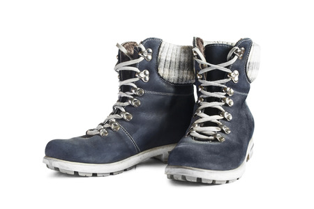 Blue nubuck leather hiking boots isolated over whiteの写真素材