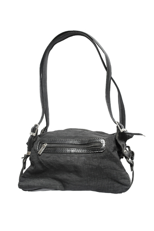 Black textile bag with leather decorations isolated over whiteの写真素材