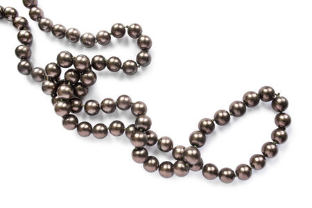 String of dark pearl on white backgroundの写真素材