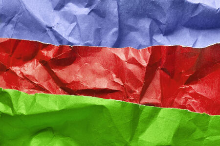 Sheets of crumpled multicolor paper as a backgroundの写真素材