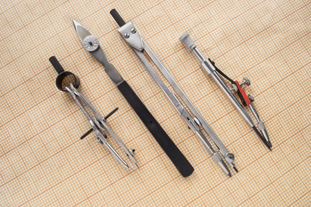 Set of drawing tools on blank graph paper as a backgroundの写真素材