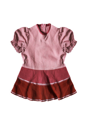 Pink baby dress with lantern sleeves isolated over whiteの写真素材