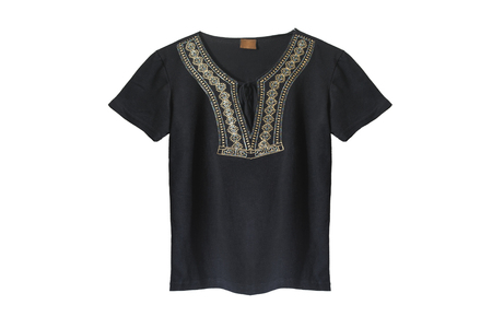 Black blouse decorated with golden ethnic embroidery on white backgroundの写真素材