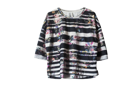 Striped black and white sweatshirt with printed flowers isolated over whiteの写真素材
