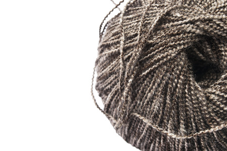 Brown melange textured yarn over white closeup as a backgroundの写真素材