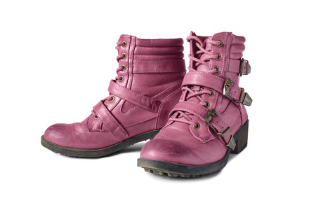 Pair of pink leather hiking boots isolated over whiteの写真素材