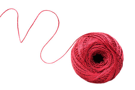 Ball of red yarn and a thread isolated over white