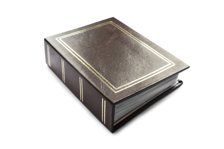 Photo album with brown leather cover isolated over whiteの写真素材