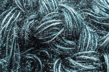 Weaving silver metallic threads closeup as a backgroundの写真素材