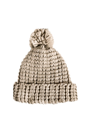 Beige knitted wool cap with pompon on white background