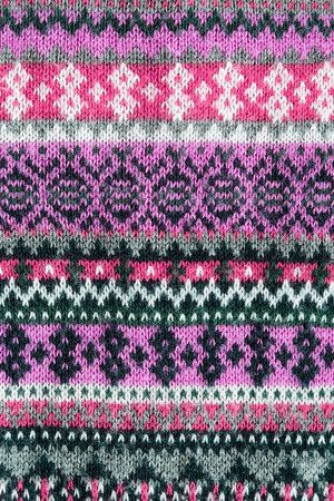 Pink knitted ornament closeup as a backgroundの写真素材