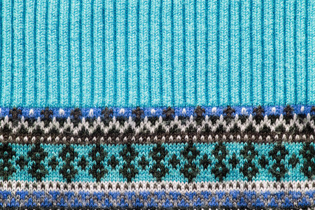 Blue ornamental knitted cloth closeup as a background