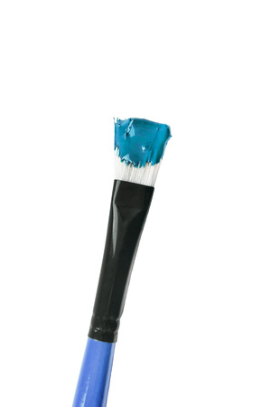 Blue paint brush isolated over whiteの写真素材