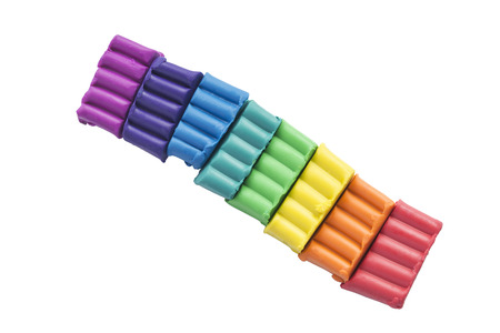 Pieces of colorful plasticine on white backgroundの写真素材