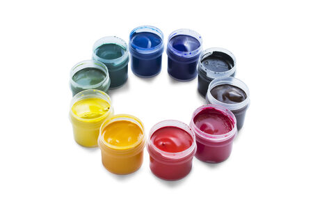 Jars of gouache paint in a round isolated over whiteの写真素材