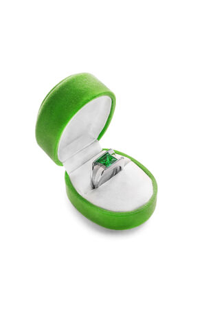 Emerald beautiful ring in a box isolated over whiteの写真素材