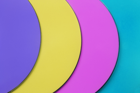 Four colorful compact discs as a backgroundの写真素材