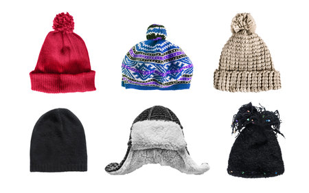 Set of winter warm hats isolated over white