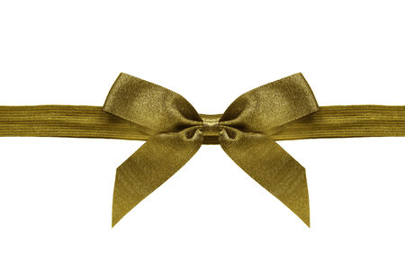 Golden silk bow on a ribbon isolated over whiteの写真素材