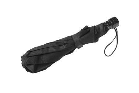 Black folded umbrella on white backgroundの写真素材