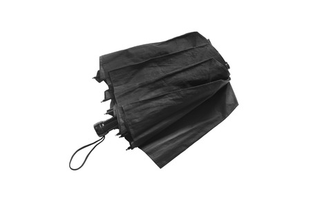 Black folding umbrella on white backgroundの写真素材