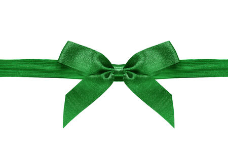 Green decorative bow on a ribbon on white backgroundの写真素材