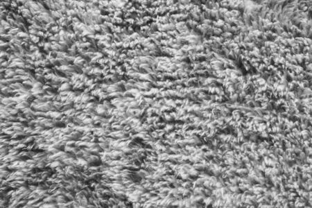 Gray wool furry material closeup as a backgroundの写真素材