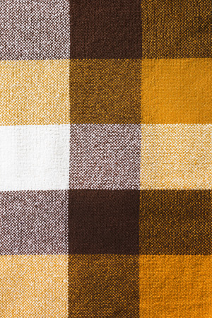 Wool plaid yellow shades cloth texture as a backgroundの写真素材