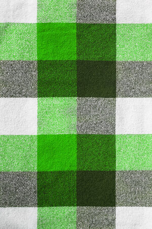 Green plaid wool material closeup as a backgroundの写真素材