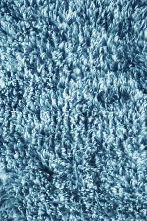 Blue wool furry cloth closeup as a backgroundの写真素材