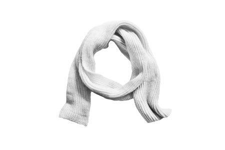 Knitted white wool scarf on white backgroundの写真素材