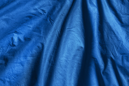 Blue draped cloth as a backgroundの写真素材