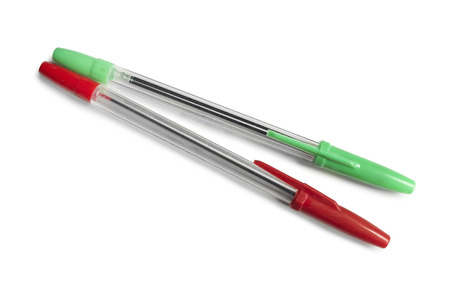 Red and green pens on white backgroundの写真素材