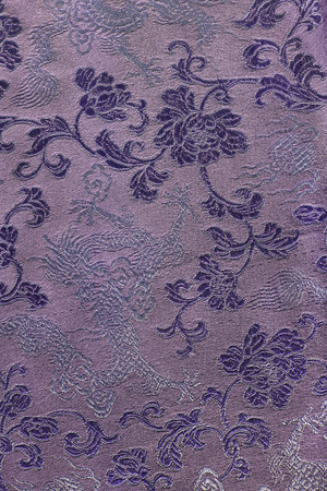 Purple embroidered silk closeup as a backgroundの写真素材