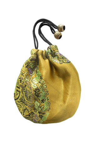 Golden silk embroidered pouch on white backgroundの写真素材