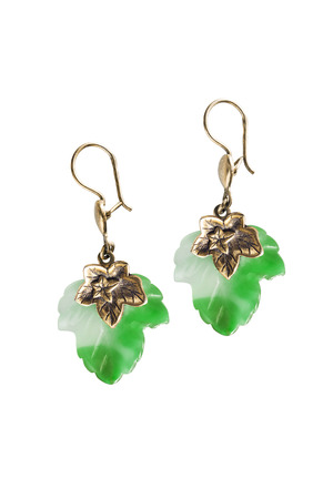 Nephrite earrings in the shape of maple leaves on white backgroundの写真素材