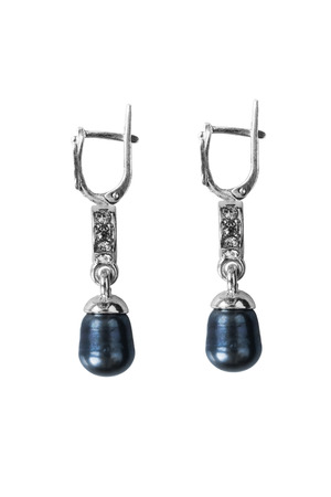 Dark pearl earrings on white backgroundの写真素材