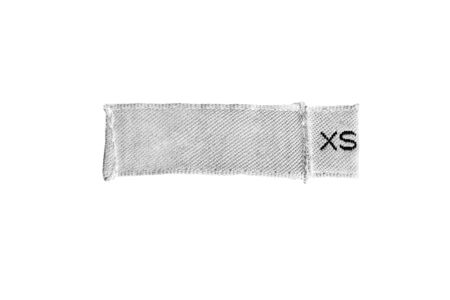 White blank XS size label isolated over whiteの写真素材