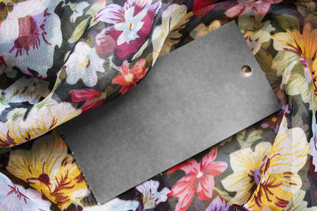 Blank black label on ornamental chiffon as a backgroundの写真素材