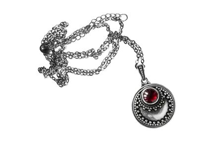 Vintage silver ruby medallion on white backgroundの写真素材