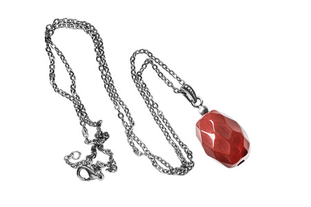 Faceted carnelian pendant on white backgroundの写真素材