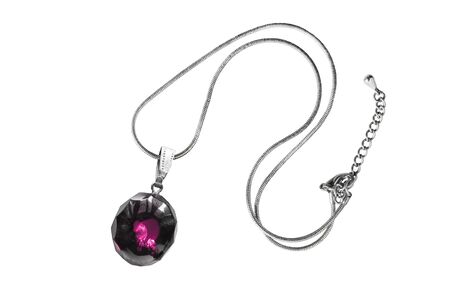 Pink gemstone pendant on a chain isolated over whiteの写真素材