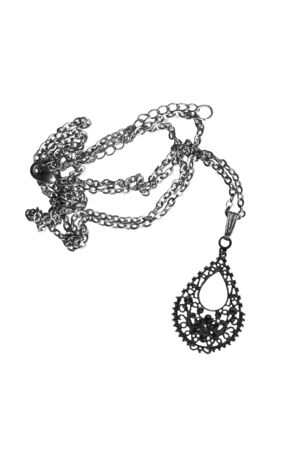 Black metal lacy pendant on white backgroundの写真素材